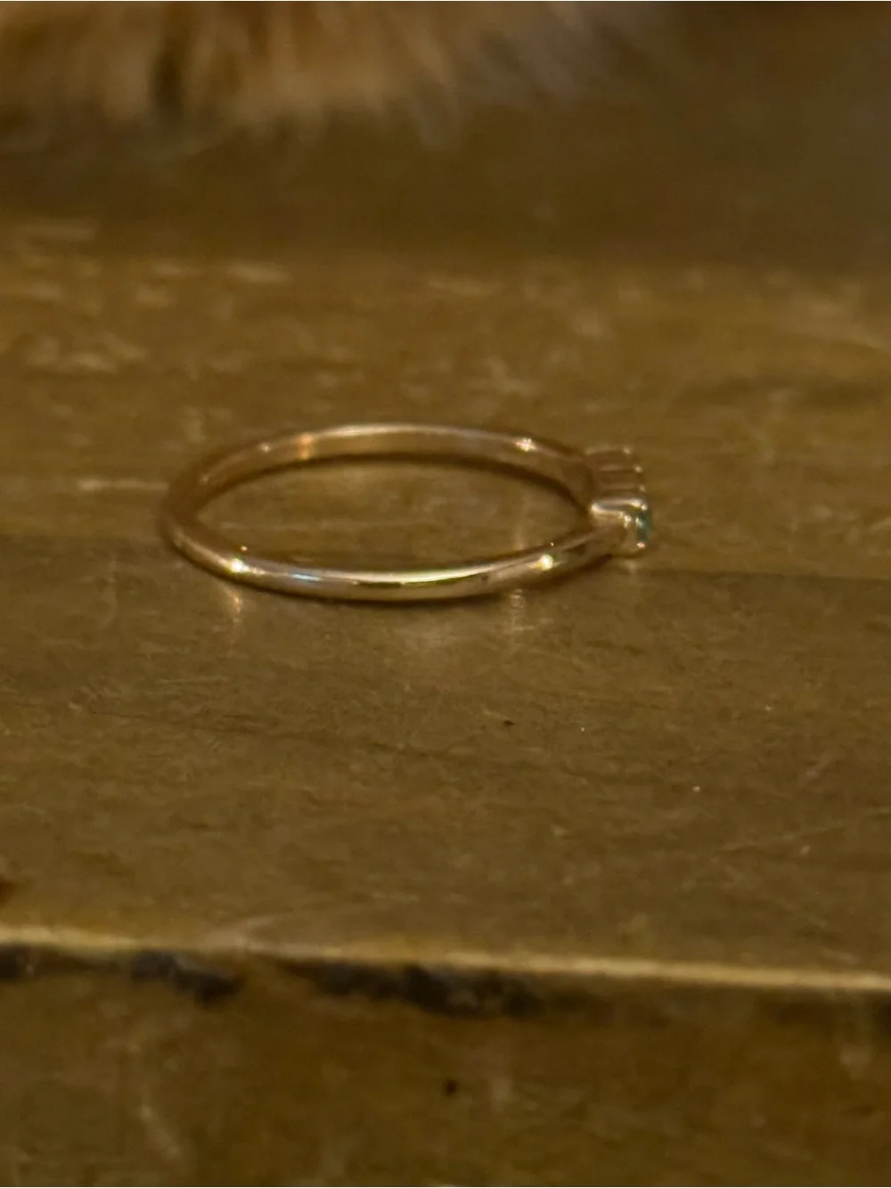 Dainty gold tone triple bezel set aquamarine ring
